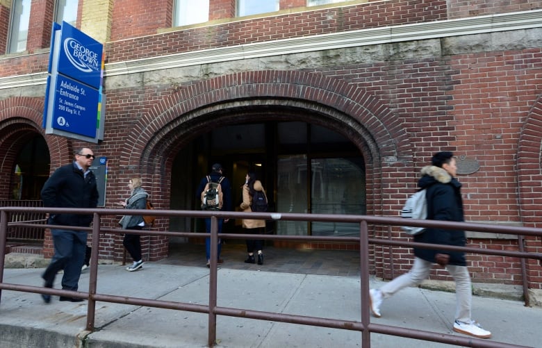 People walking in front of George Brown College entrance.